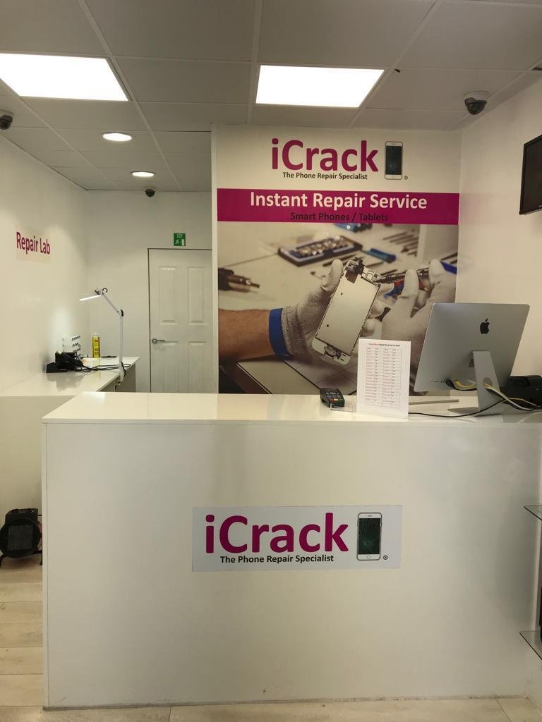 Inside iCrack Carmarthen repair shop showing front desk and phone repair service area